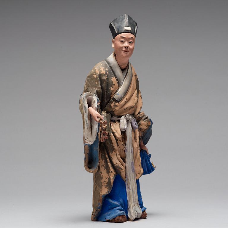 A clay figure of a chinese man, Qing dynasty, 19th Century.