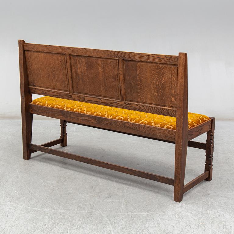 A 20th century renaissance style sofa.