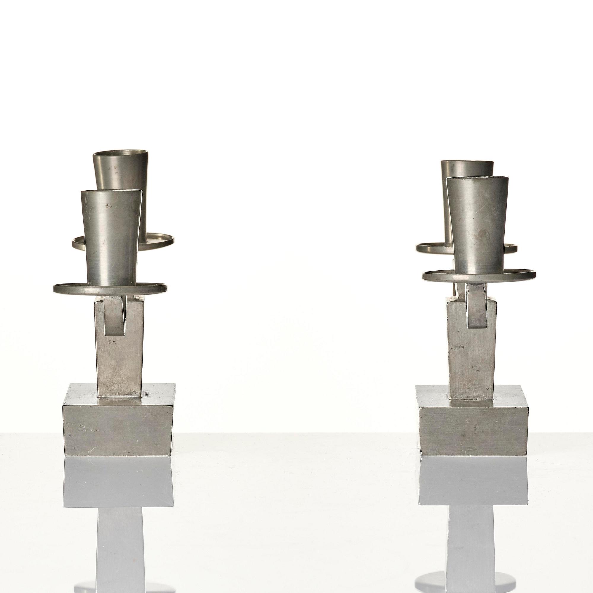 Nils Fougstedt, a pair of pewter candelabra model "A 1047", Firma Svenskt Tenn, Stockholm 1932.