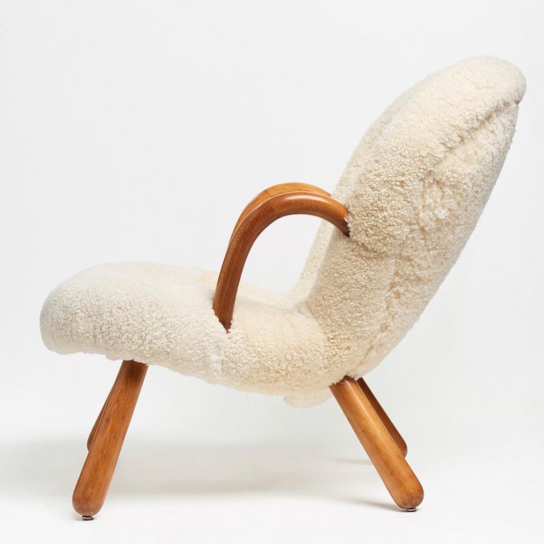 Philip Arctander, attributed to, a Clam Chair re-upholstered in white sheepskin, executed or sold by Vik & Blindheim Norway.