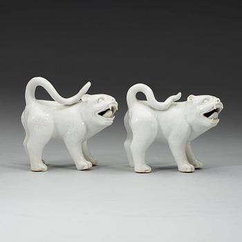 A set of two blanc de chine mythological animals, late Qing dynasty.