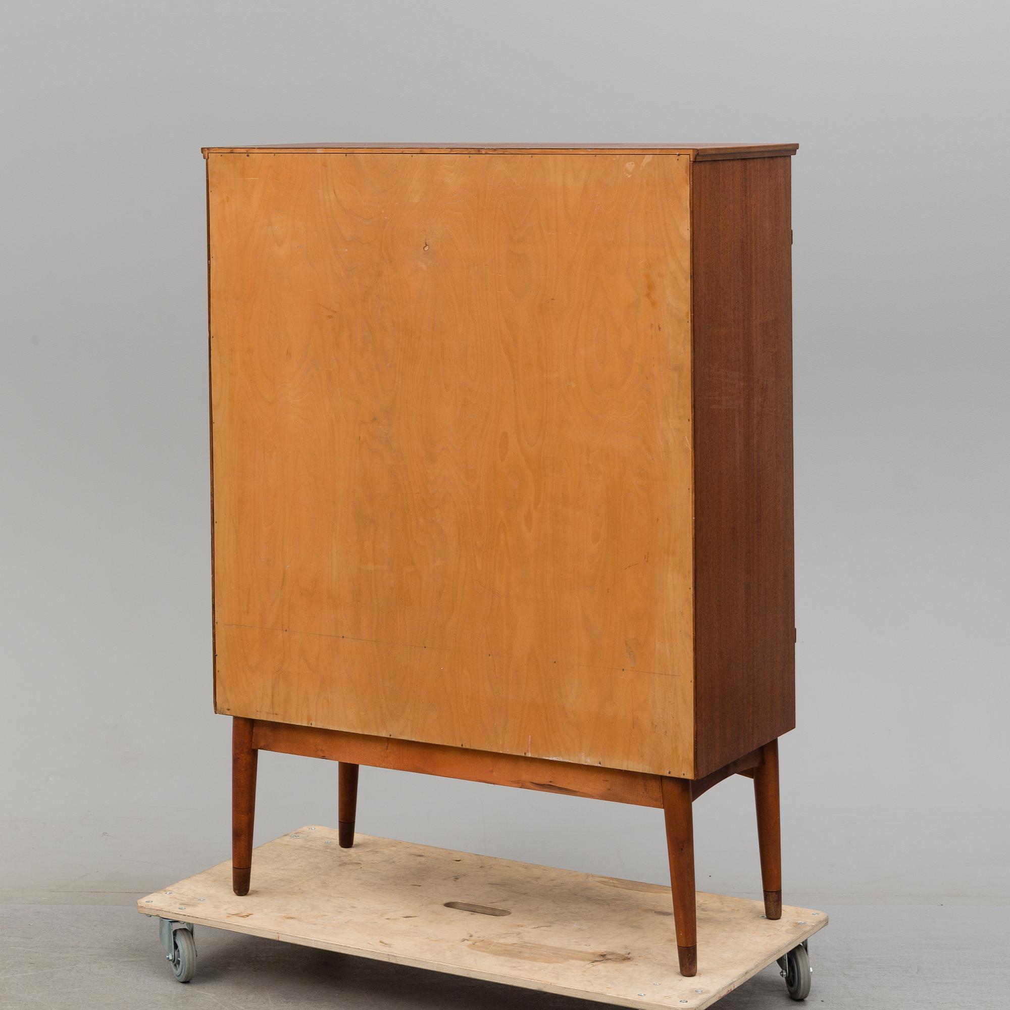 A cabinet veneered with teak designed by Kirke Nielsen for Abrahamssons Möbelfabrik in Smålands Taberg, 1950´s.