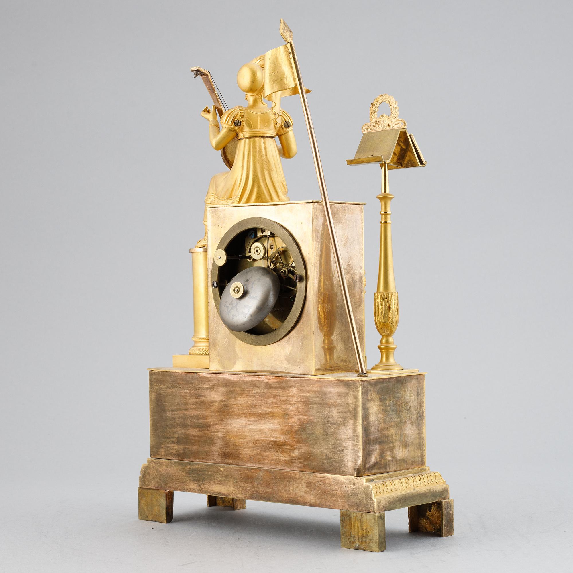 A French Empire gilt bronze mantel clock, early 19th Century.
