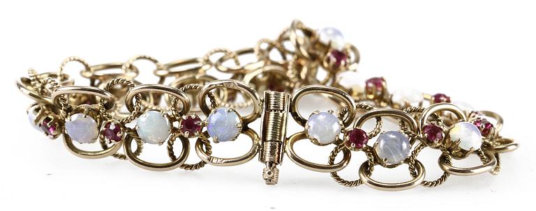 ARMLÄNK, 14 K guld, rubiner samt stenar.