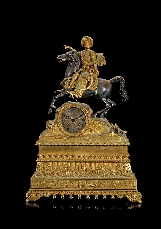 A French 1830/40's gilt and silvered bronze and brass mantel clock.