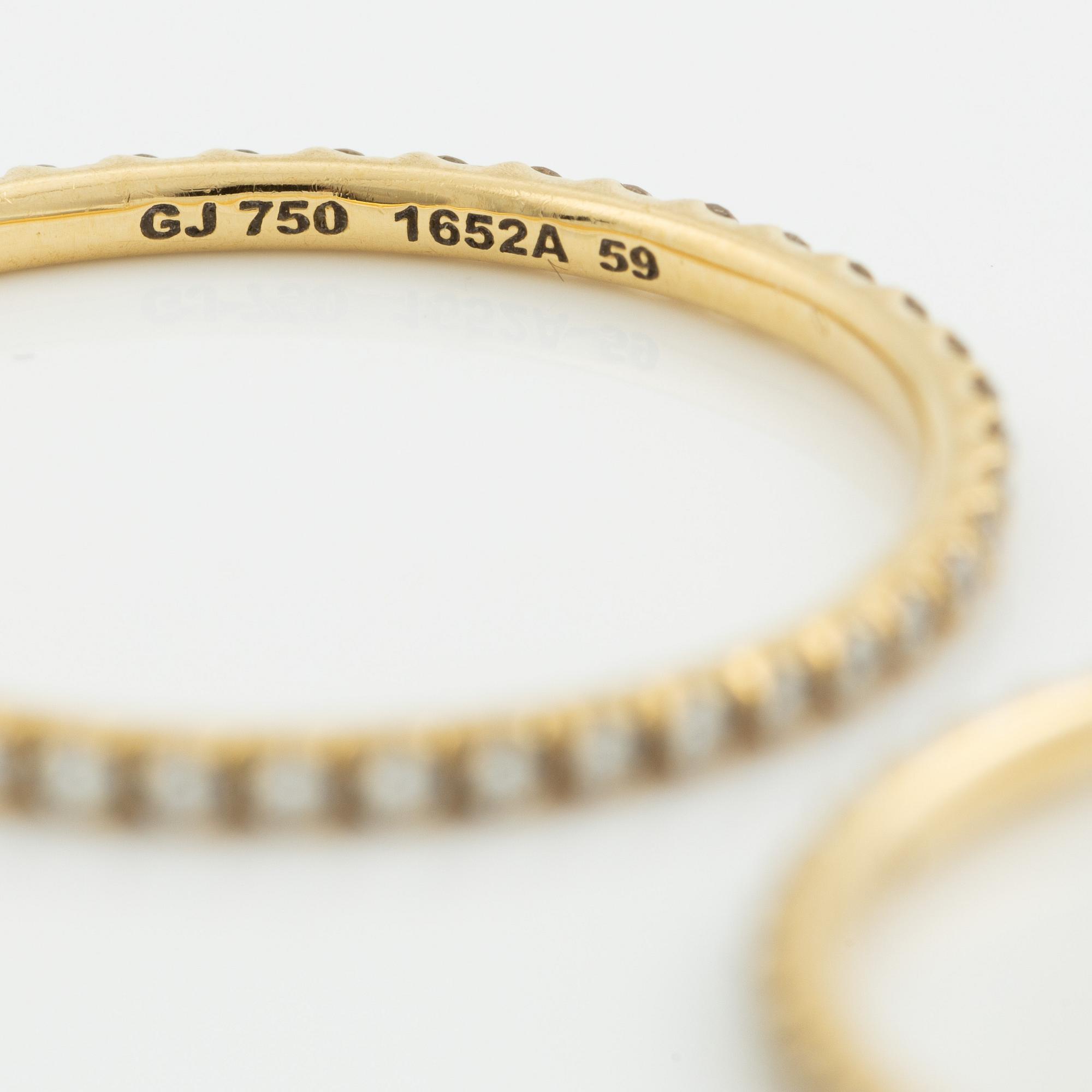 Ringar, Georg Jensen. ett par, "Signature", 18K guld med briljantslipade diamanter.