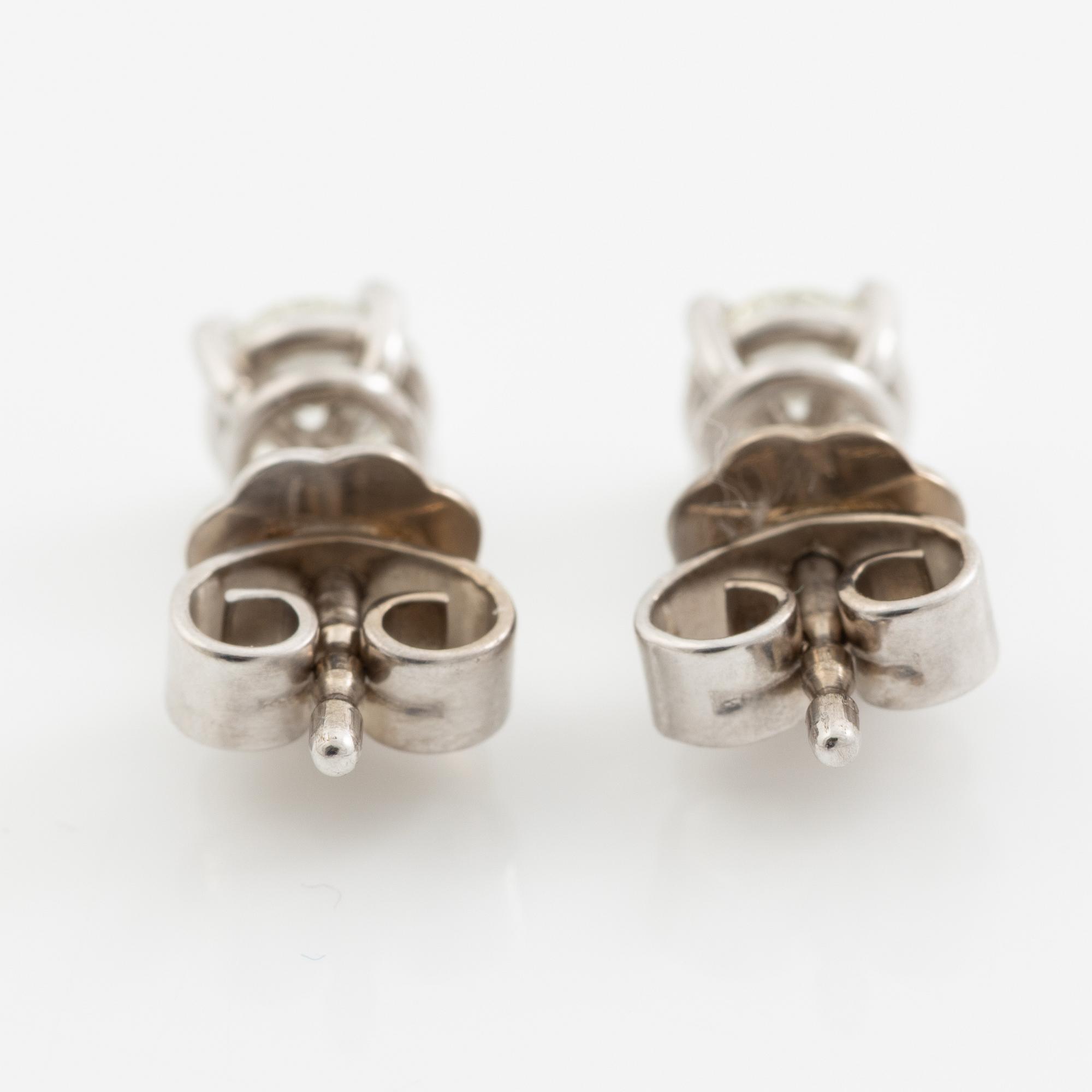 Earrings, a pair, 18K white gold with brilliant-cut diamonds totalling 0.60 ct.