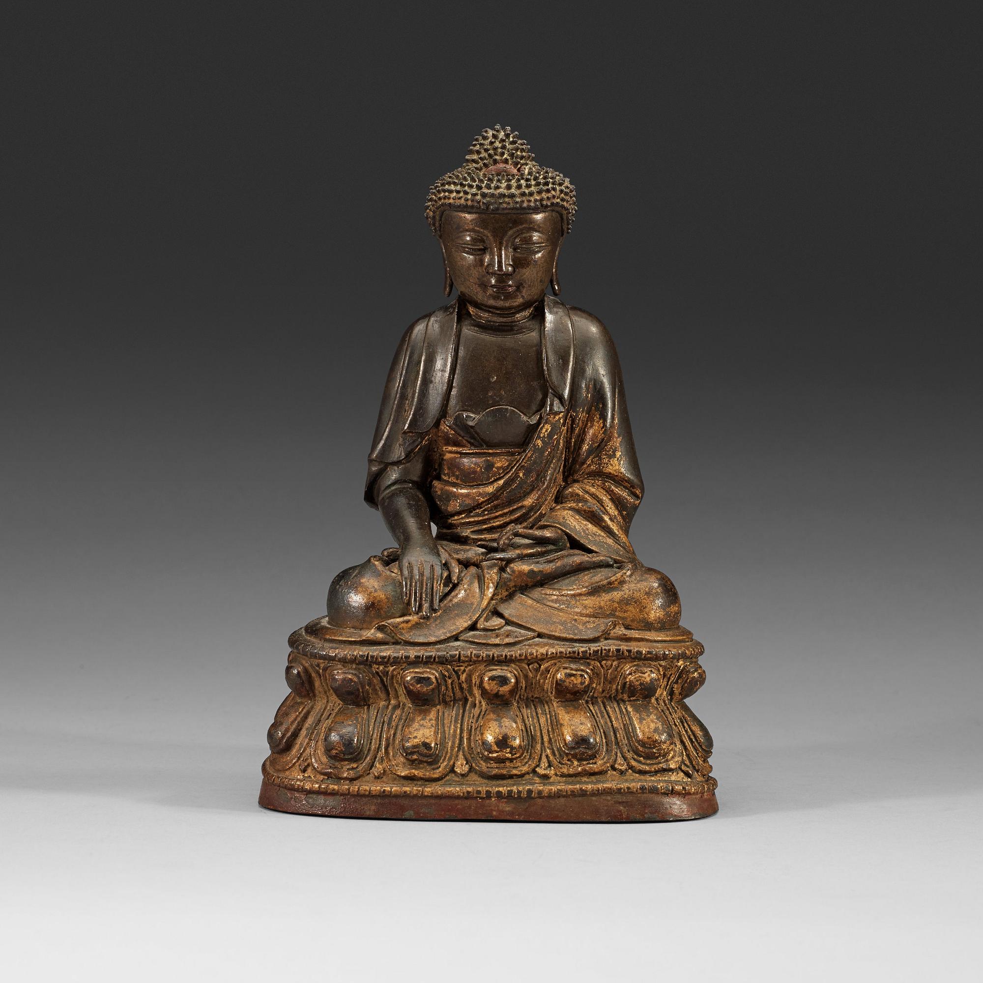 A gilt bronze figure of Buddha Sakyamuni, Ming dynasty (1368-1644).