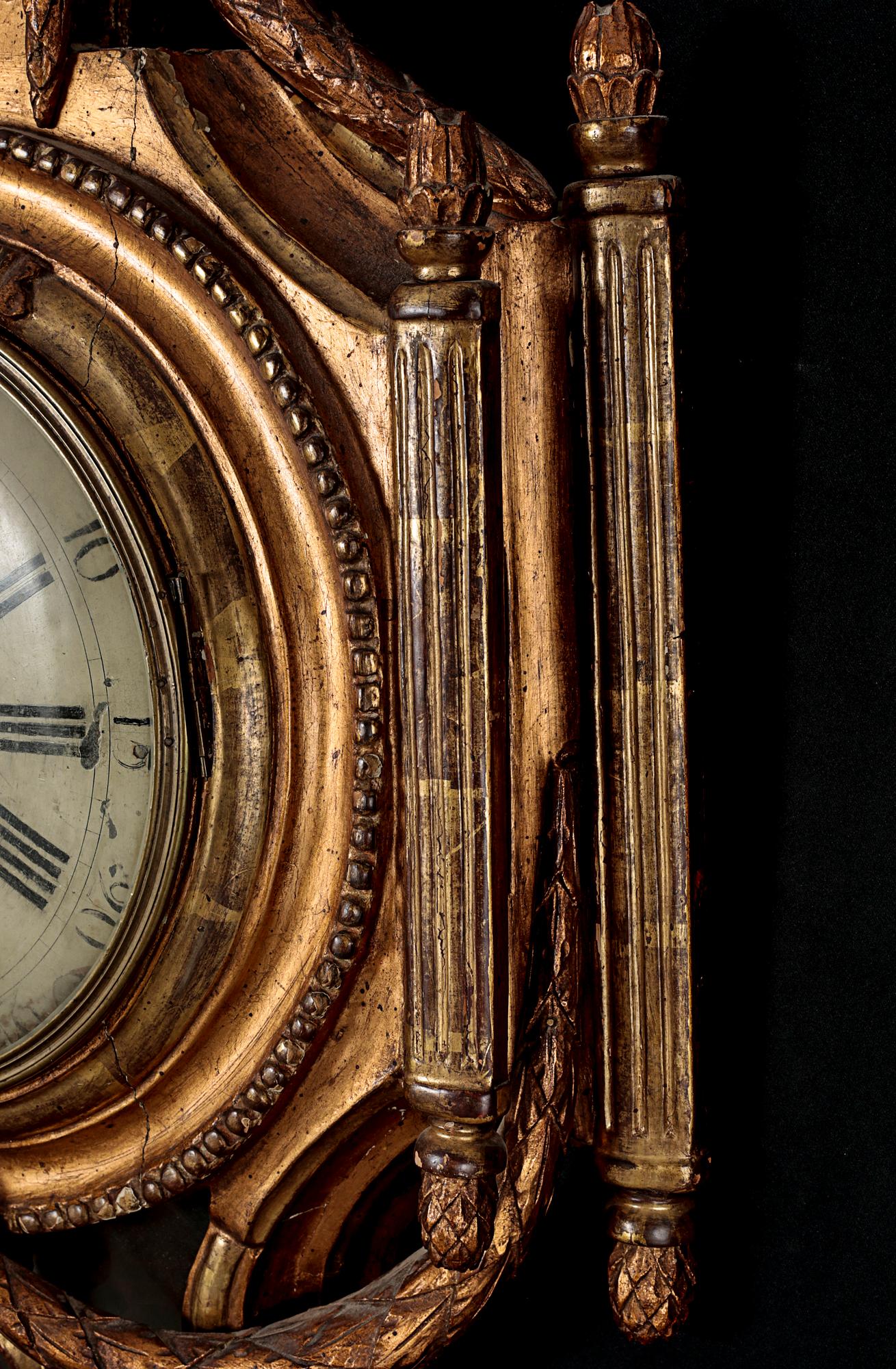 A Gustavian wall hanged clock, dial marked "Jacob Kock Stockholm", maded in the second half of the 18th century.