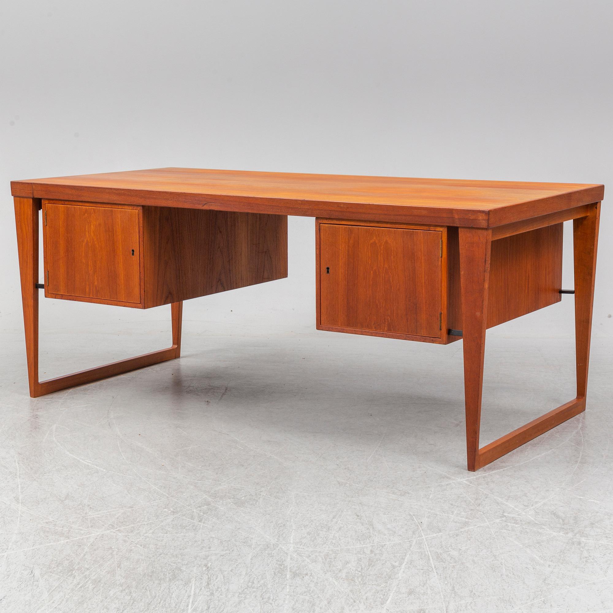 A 1960's teak model 70 writing desk by Kai Kristiansen.