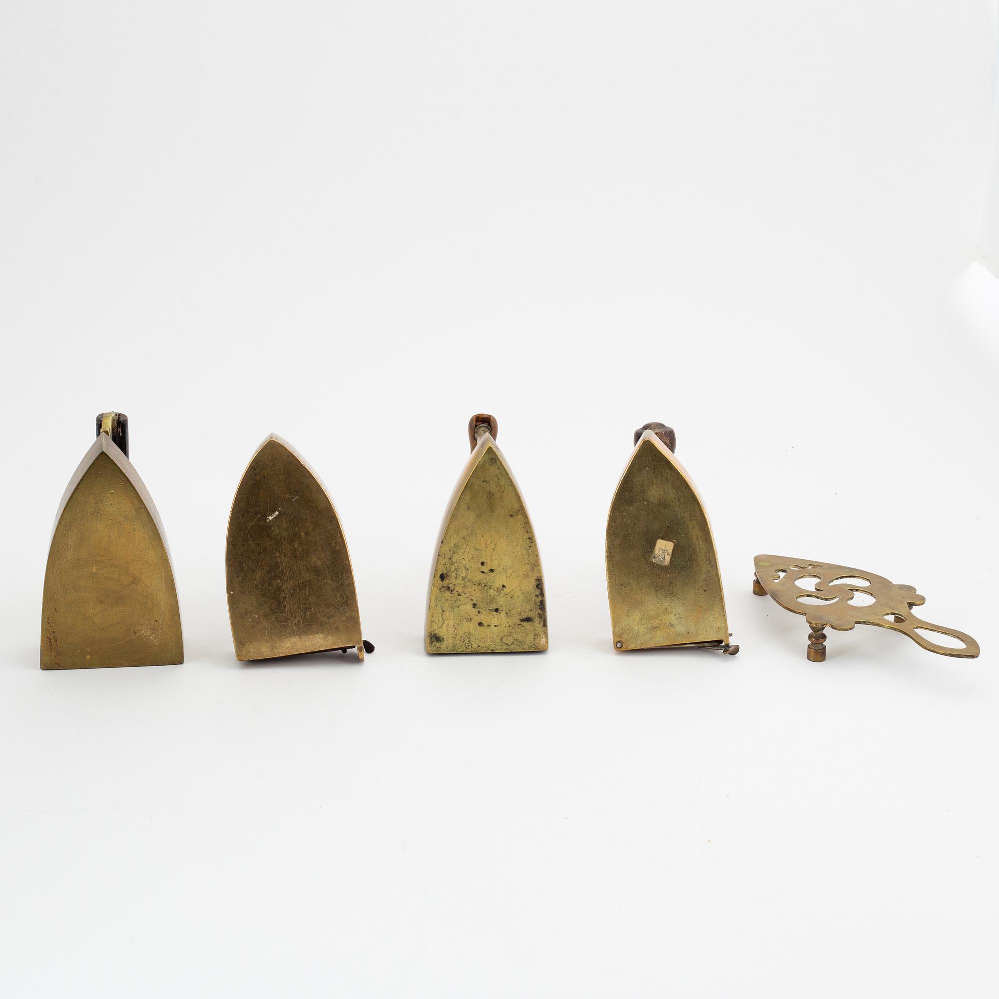 A set of four Swedish brass irons, 18th/19th Century.