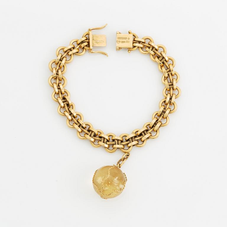 Claës E. Giertta, armband 18K guld med berlock med citrin.
