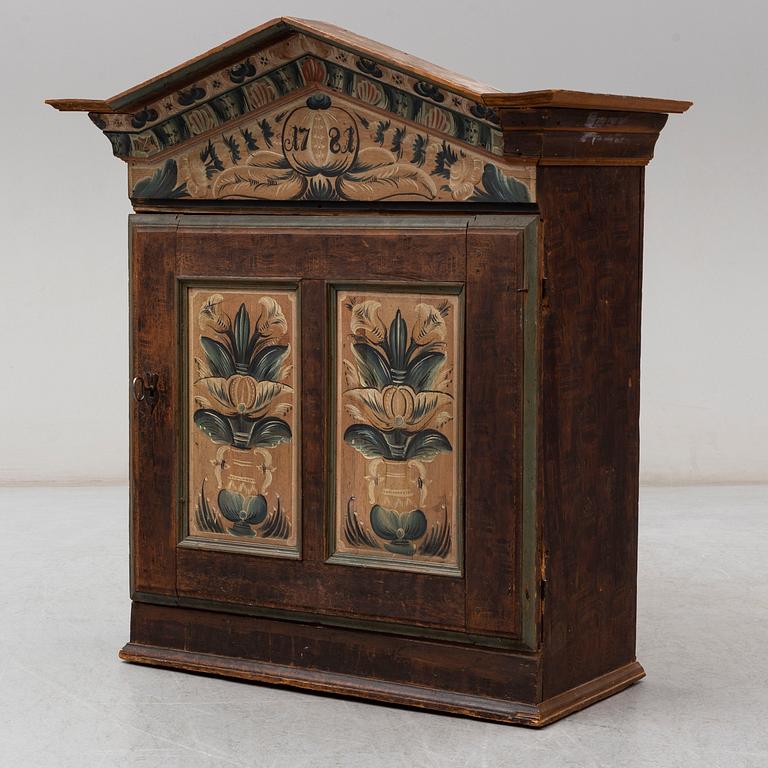 An 18th century folk art cabinet.