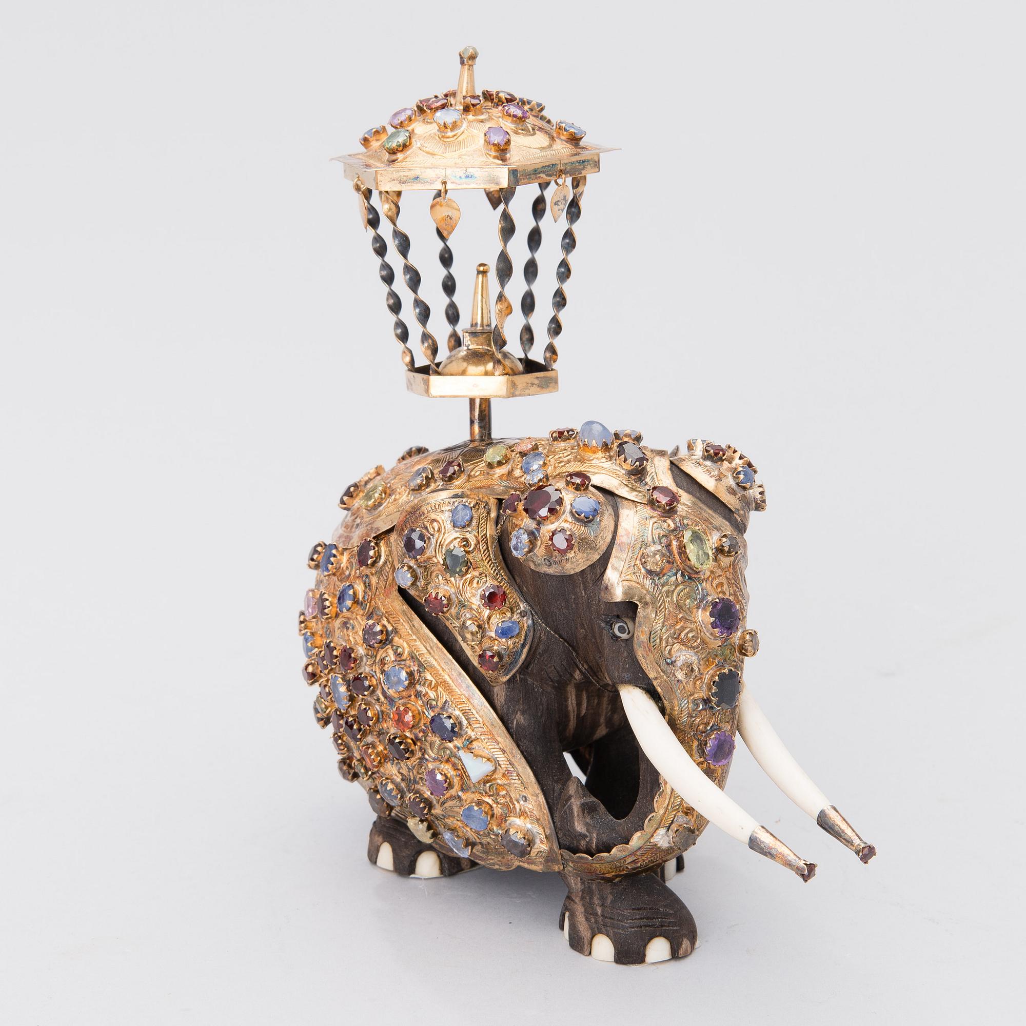 A SRI LANKAN ELEPHANT SCULPTURE, wood, silver and semi-precious stones, second half of the 20th century.