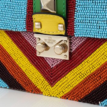 Valentino, a multicolor pearl embroidered rock stud bag.