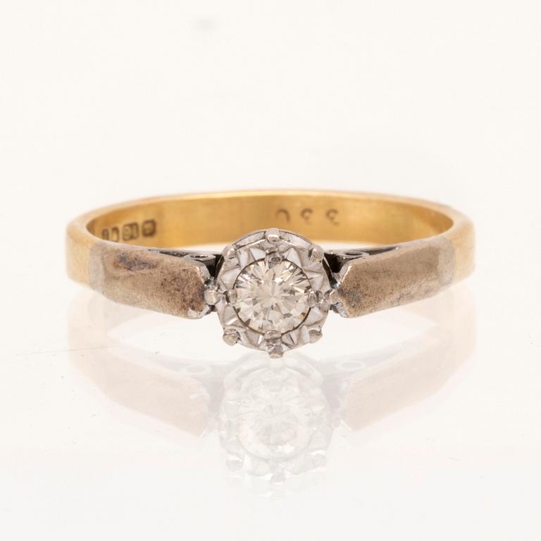 An 18K white and red gold ring set with a round brilliant cut diamond.