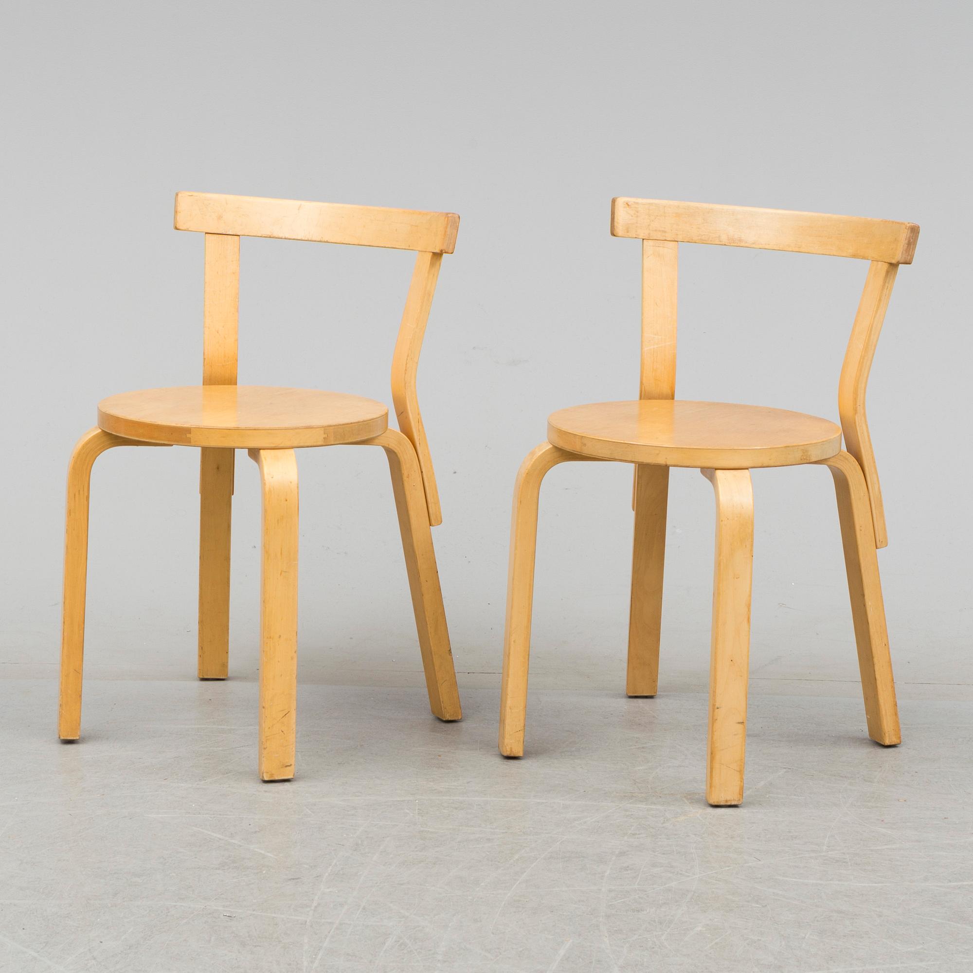 Nine model 68 chairs by Alvar Aalto, designed in 1935.