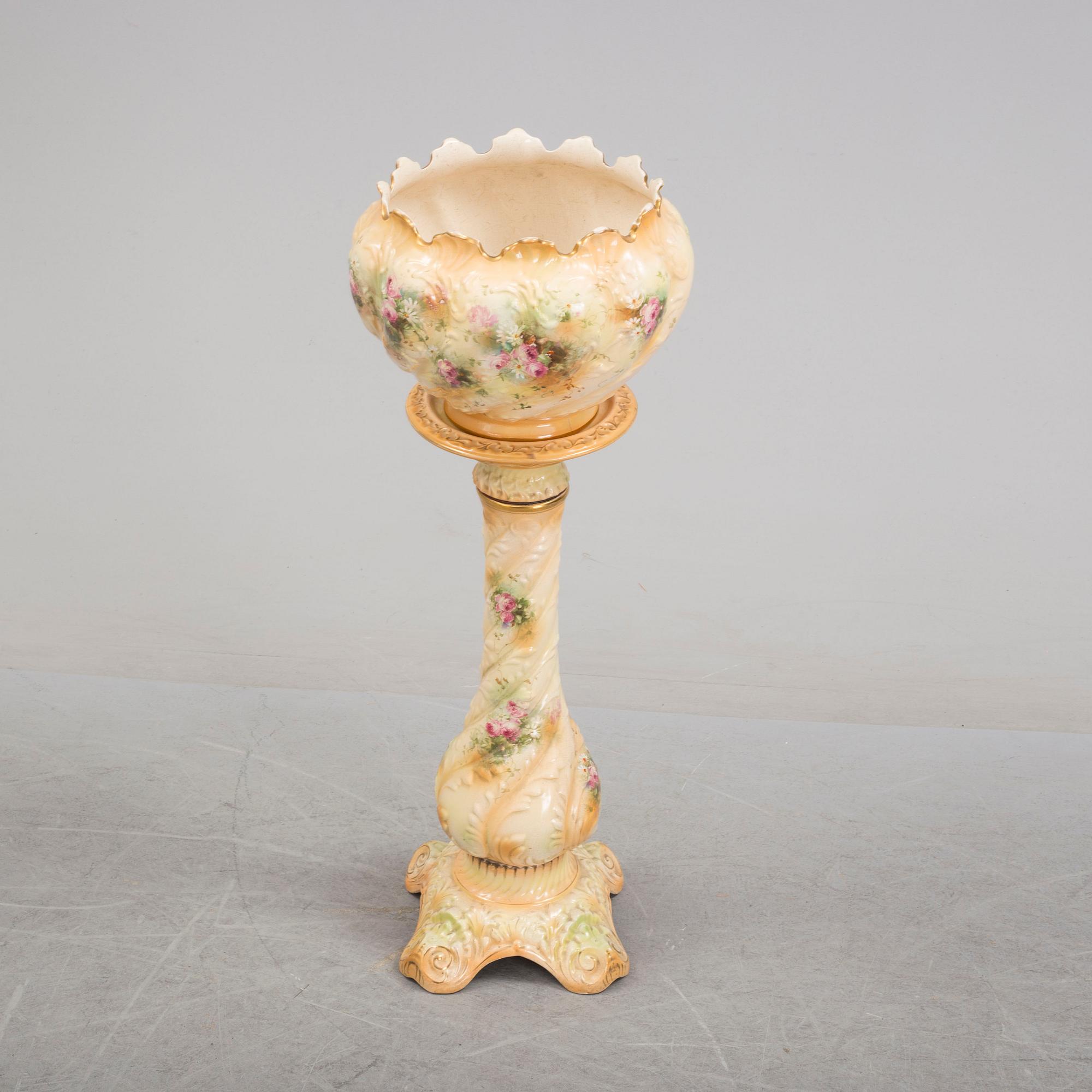 An early 20th century pedestal and flowerpot.