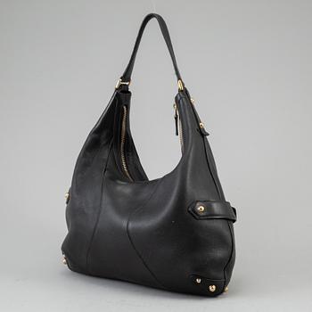 GUCCI, a leather horse-bit bag.