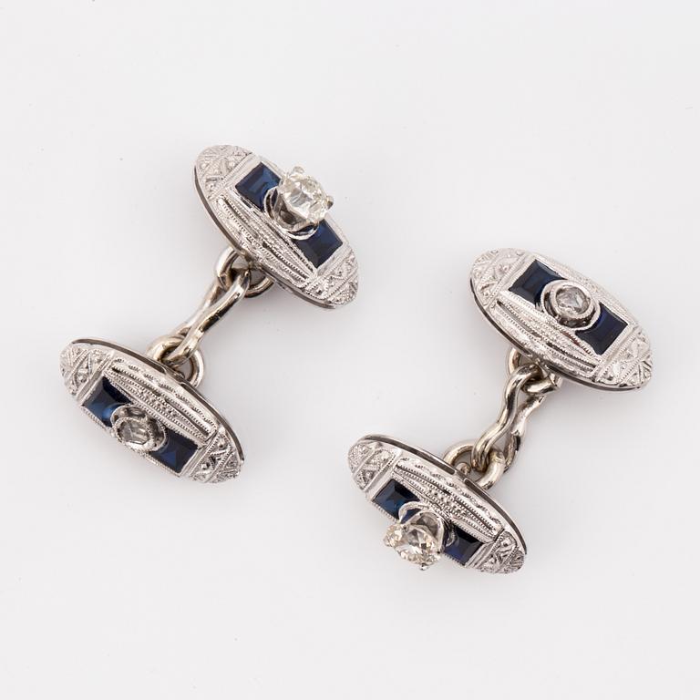 A pair of diamond and most likely synthetic sapphire cufflinks.