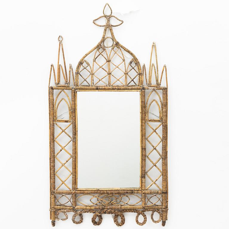 A rattan mirror from around the year 1900.