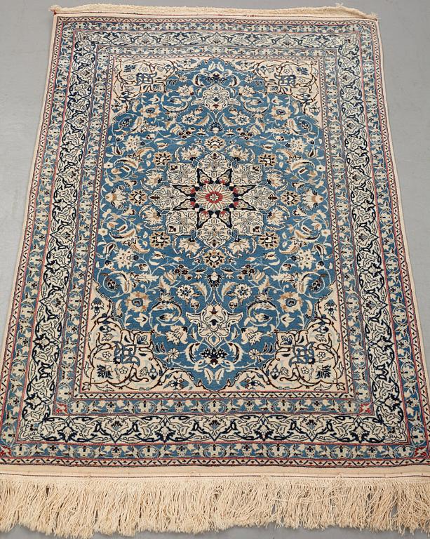 A rug, semi-antique Nain, part silk, ca 122,5 x 80 cm (as well as 1,5 cm flat weave at the ends).