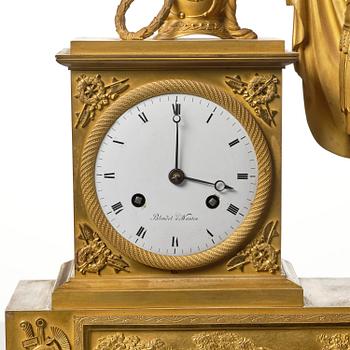 A French Empire figural ormolu mantel clock, early 19th century.
