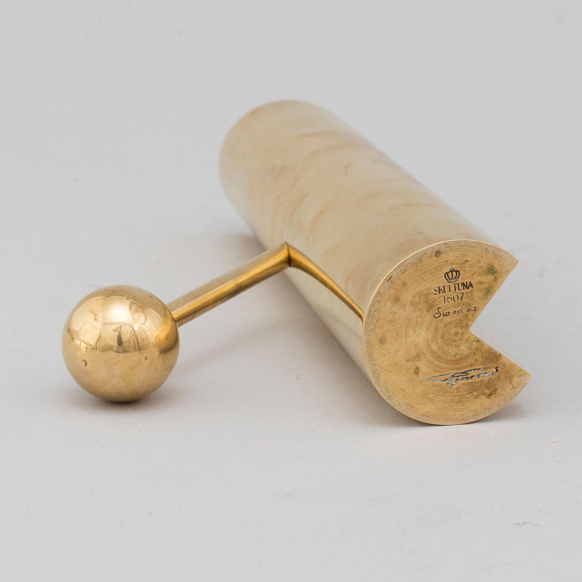 A brass candle holder by Pierre Forssell for Skultuna.