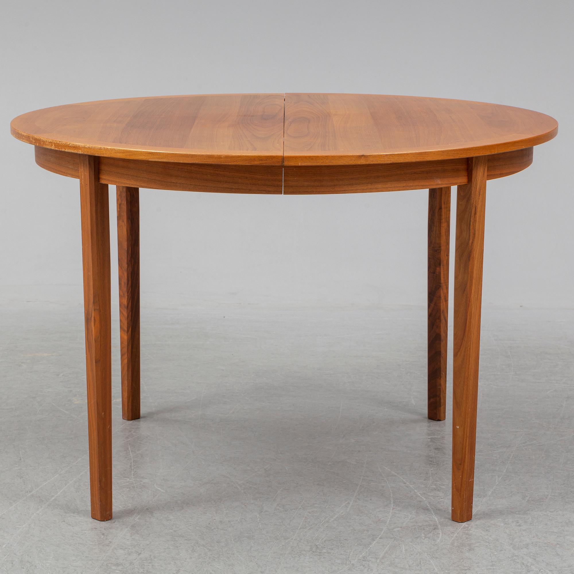 A 1950/60s teak and valnut table and four chairs.