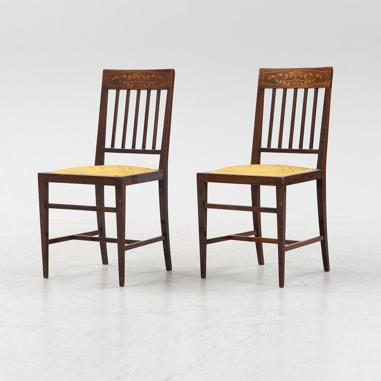 A group of five rosewood veneered chairs and a stool, mid 20th Century.