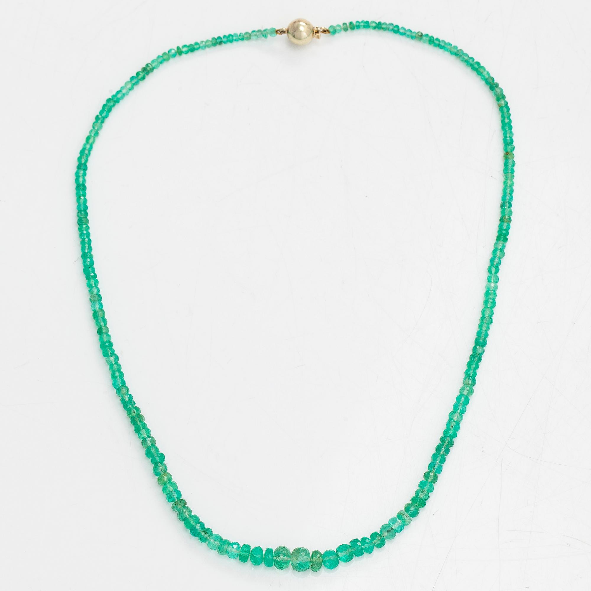 A necklace, set with emeralds, clasp in 14K gold.