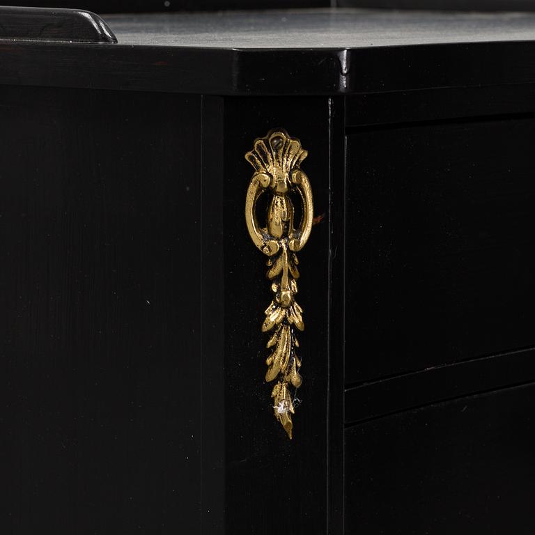 A second half of the 20th Century rococo style pair of bedside drawers.