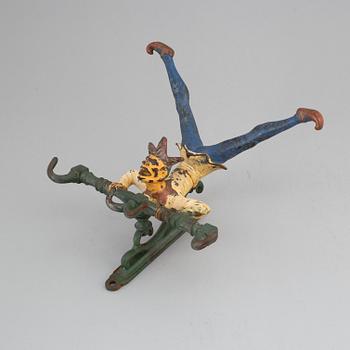 A cast iron clothes-hanger from the 20th century.