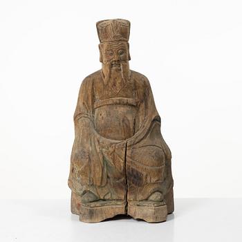 A wooden sculpture of a daoist dignitary, late Qing dynasty.
