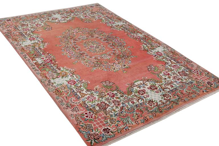 A Tabriz carpet, c. 410 x 199 cm.