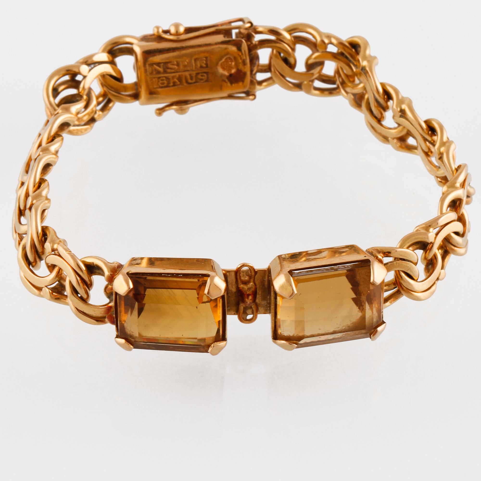 ARMBAND, 18K guld med fasettslipade citriner, NSE, Köping, 1970. Vikt 26,0 gram.