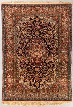 An antique Isfahan carpet ca 212 x 140 cm.