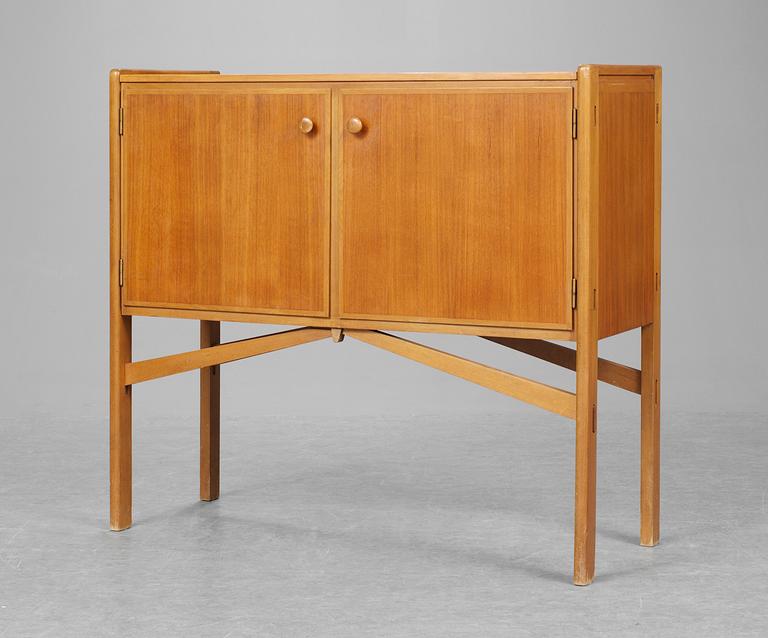 A Carl-Axel Acking teak and beech cabinet by Svenska Möbelfabrikerna Bodafors, Sweden.