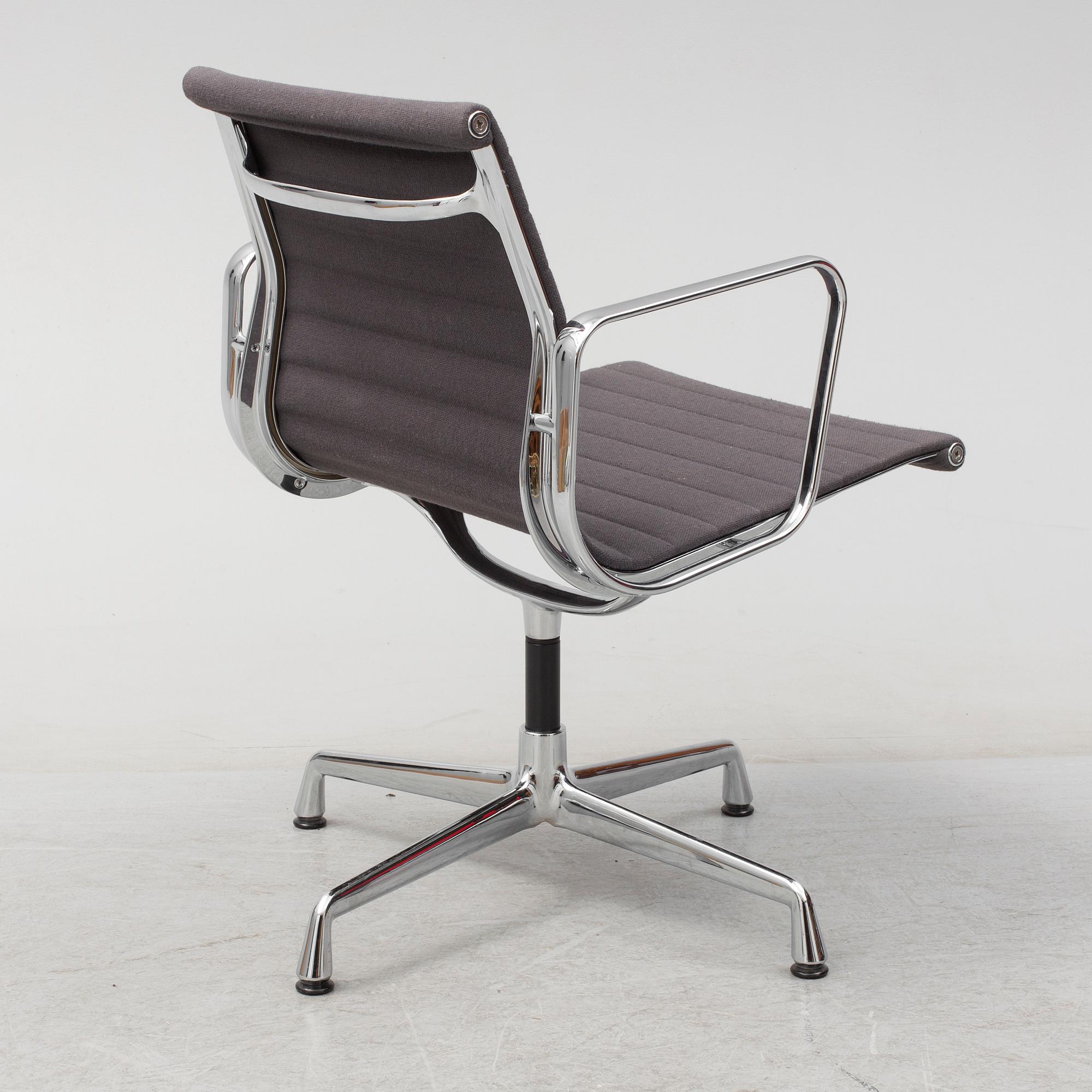 An 'EA 104 Swivel' armchair by Charles & Ray Eames, Vitra, 2007.