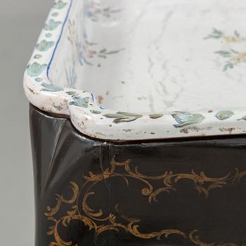 A Swedish Rococo faience tea table, Marieberg 1770.
