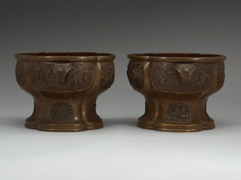 A pair of bronze flower pots, Qing dynasty, with Xuande six character mark to the interior.