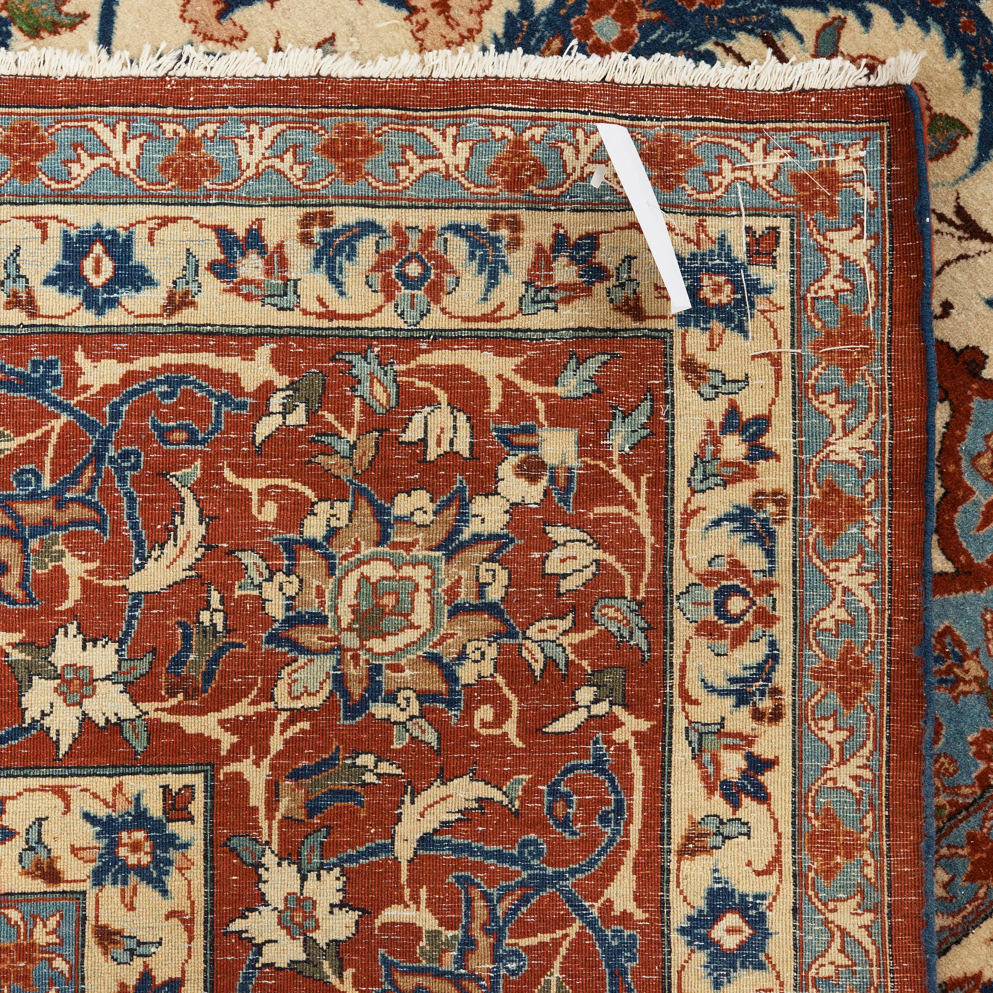 A old Esfahan carpet, around 299 x 210 cm.