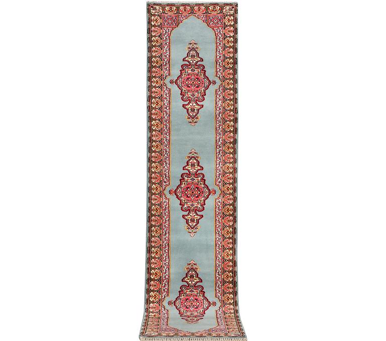 An oriental runner, c. 550 x 74 cm.