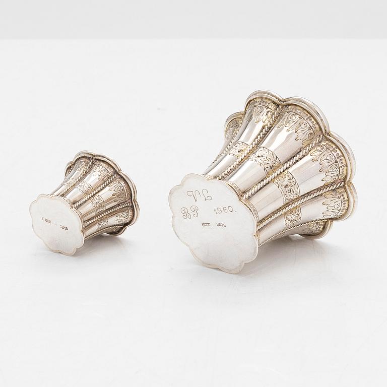 Two miniature beakers and a butter pan, Copenhagen, 1950s, and a silver-plated bottle coaster.