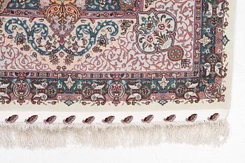 A Tabriz carpet, 210 x 195 cm. signed.