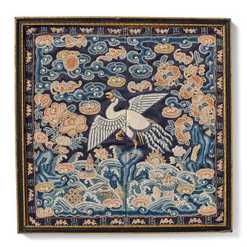 957. A civil offical's rank badge with a silver pheasant in Peking knot, Qing dynasty, early 19th century.