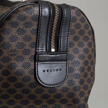 a CÉLINE weekend bag.