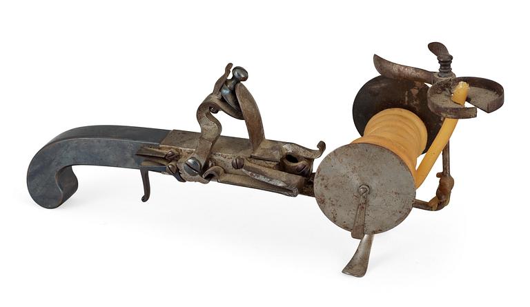 A steel flintlock tinderlighter circa 1800.