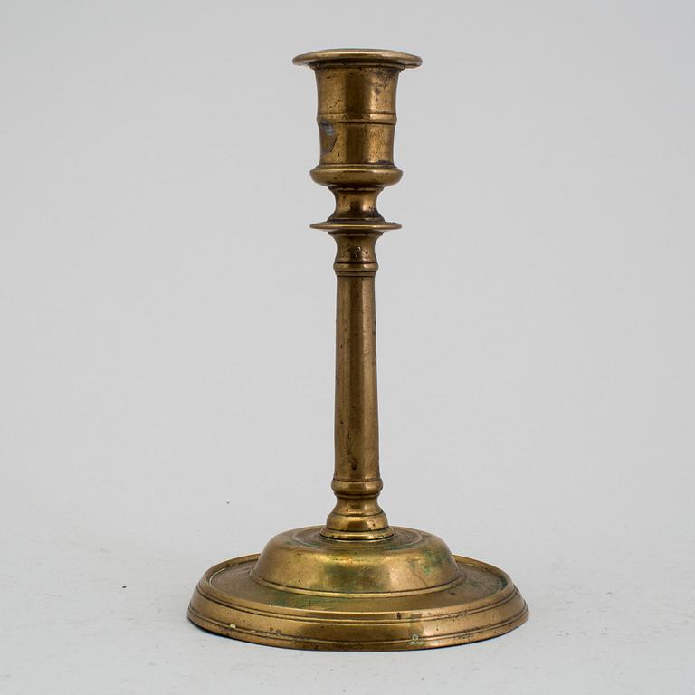 A 1500s bronze candlestick.