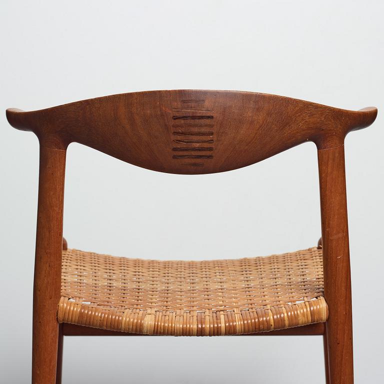 Hans J. Wegner, a set of six teak and rattan "Cowhorn Chairs" "JH-505", executed by cabinetmaker Johannes Hansen, Denmark 1950-60's.